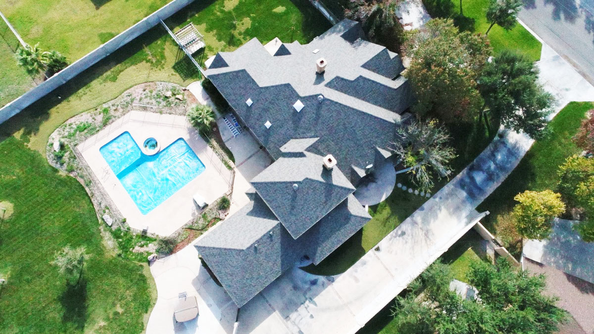 Above view of a large roof with a pool on the backyard - Griffin